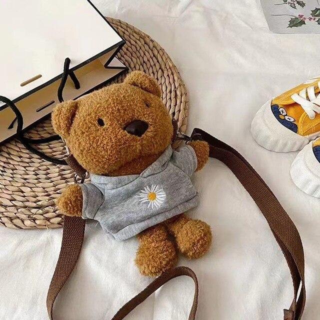 https://www.kawaiies.com/cdn/shop/products/kawaiies-plushies-plush-softtoy-brown-bear-bag-accessories-grey-hoodie-261623.jpg?v=1611163733