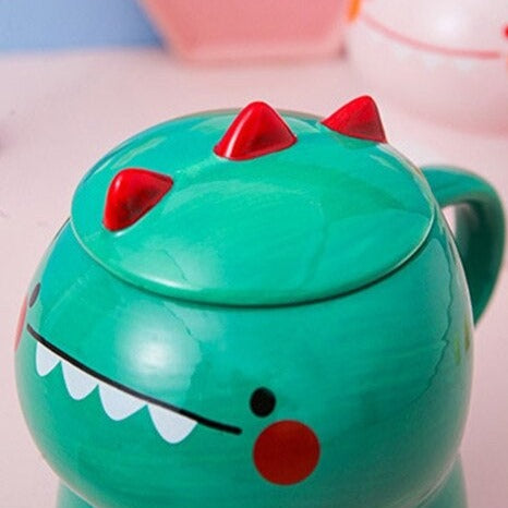 https://www.kawaiies.com/cdn/shop/products/kawaiies-plushies-plush-softtoy-cute-cartoon-dinosaur-ceramic-mug-with-lid-new-home-decor-937758.jpg?v=1646328249